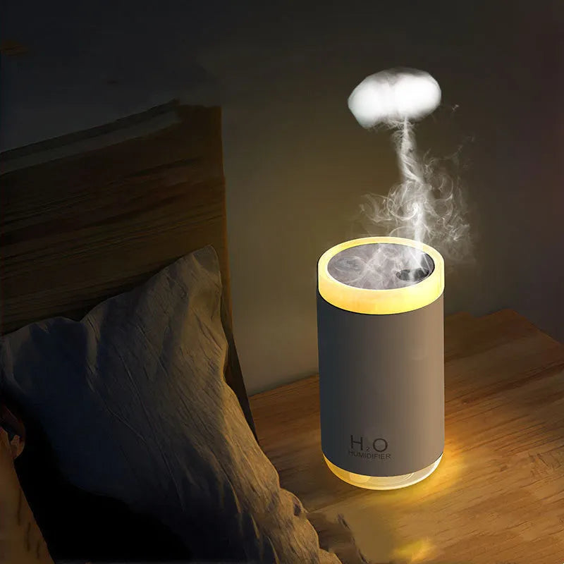 Jellyfish-shaped smoke ring humidifier with warm night light in white, pink, or blue colours