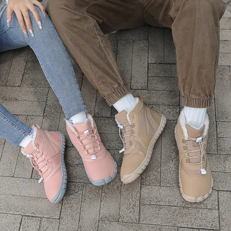 Waterproof unisex snow boots in black, khaki, or pink with round toe and front lace-up.
