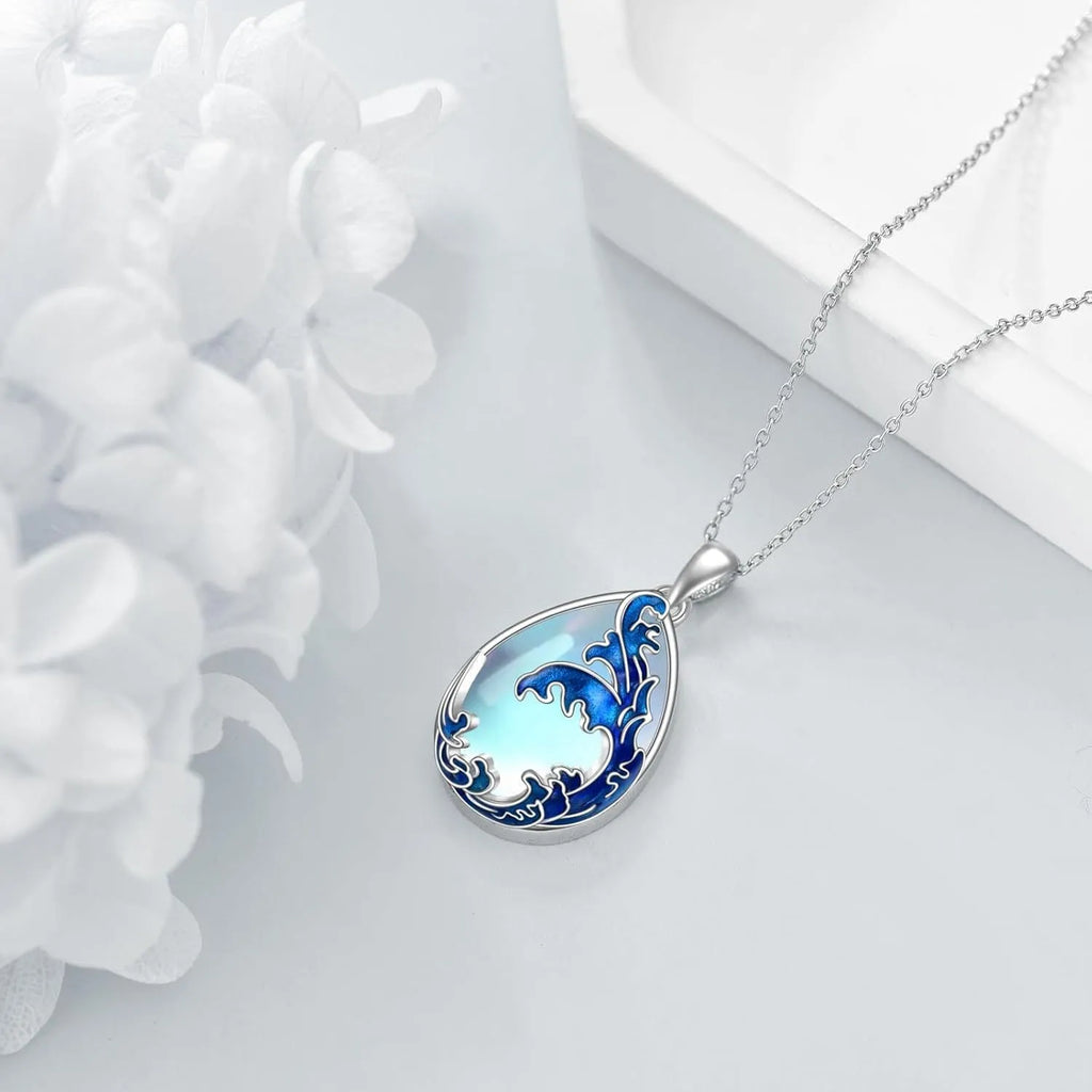 Blue alloy love heart pendant on a women's necklace chain.