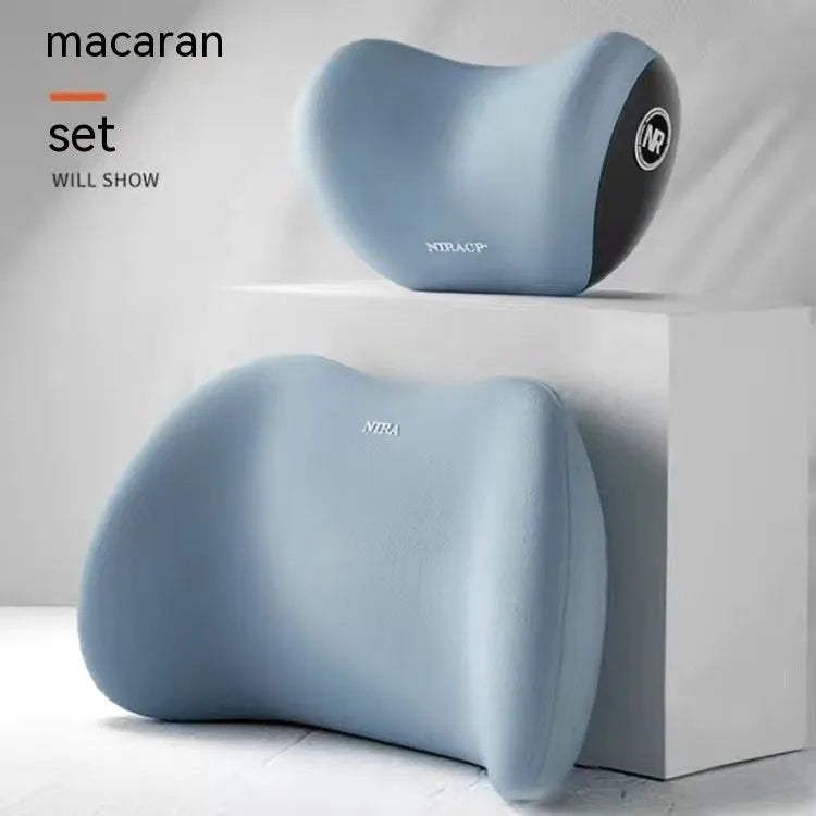 Black memory foam car headrest pillow and matching lumbar support pillow on a car seat.
