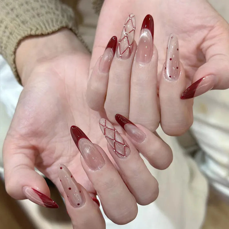 Sweet Girl Wearing Fake Nails set showing medium length coffin-shaped press-on nails with random colour designs.
