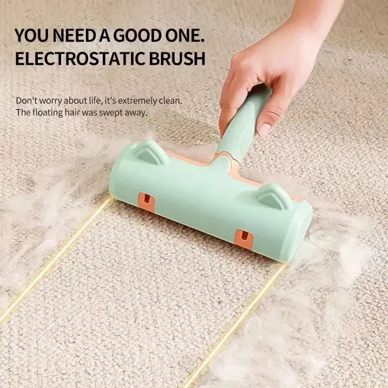 Gray self-cleaning two-way pet hair roller brush with non-slip handle on fabric surface