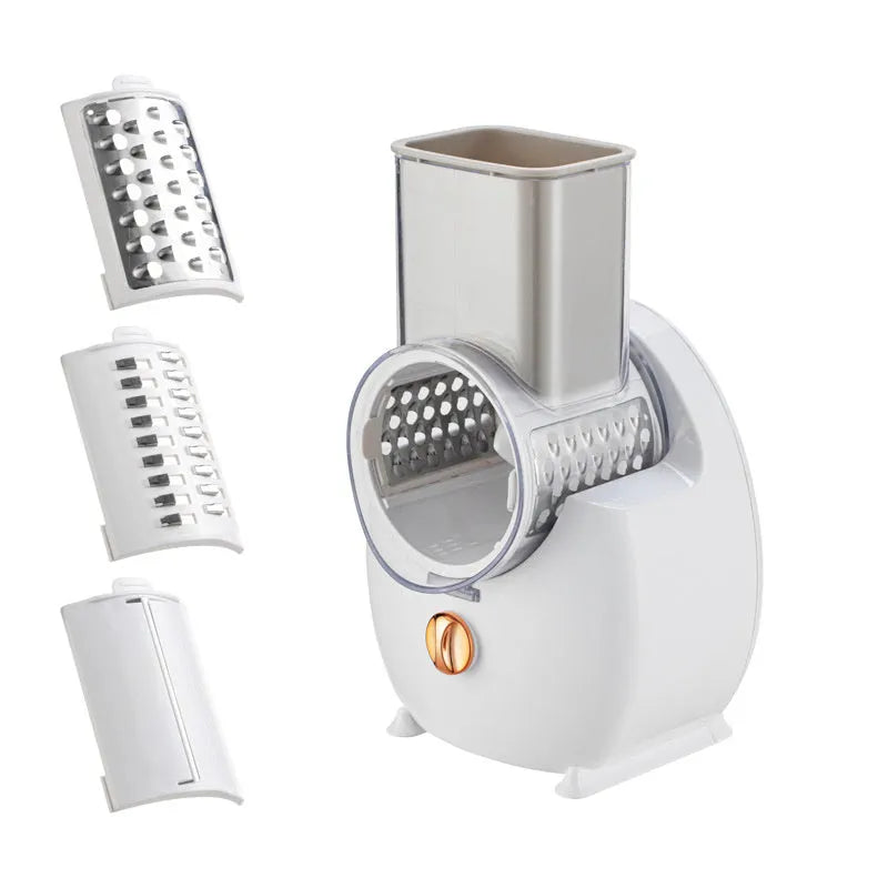 White electric vegetable slicer with suction base, multiple blades, and USB charging cable.