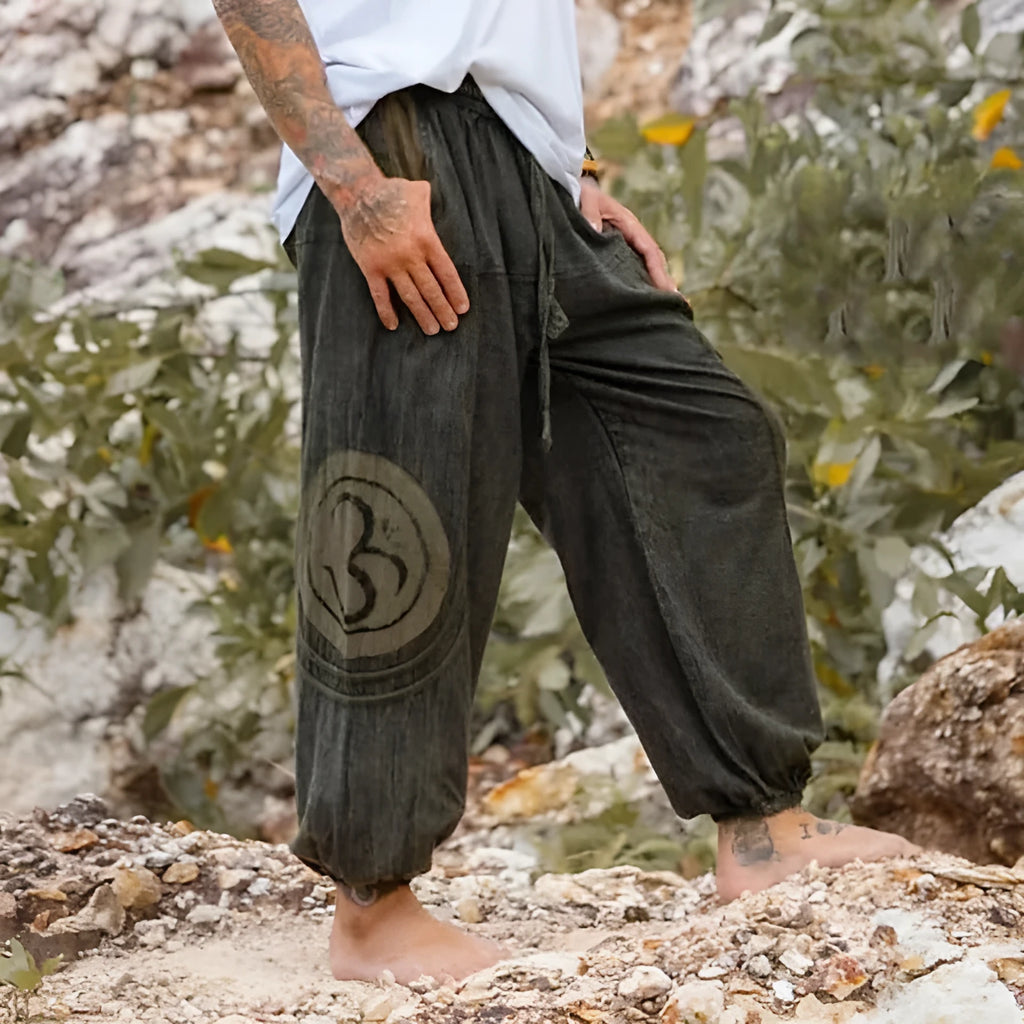 Dark green men's trousers with ethnic pattern and adjustable ankle ties