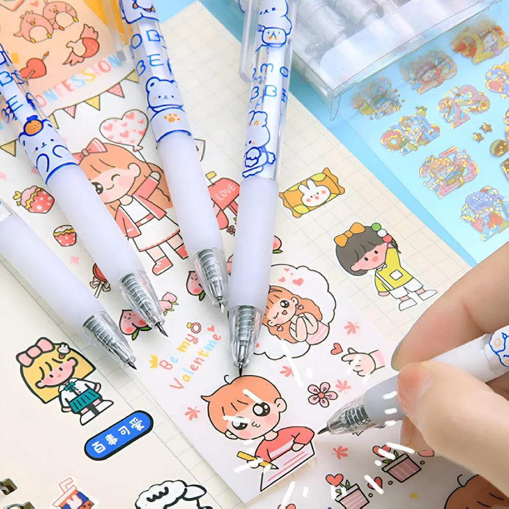 Six colourful press pen knives with bear and rabbit character designs laid out.