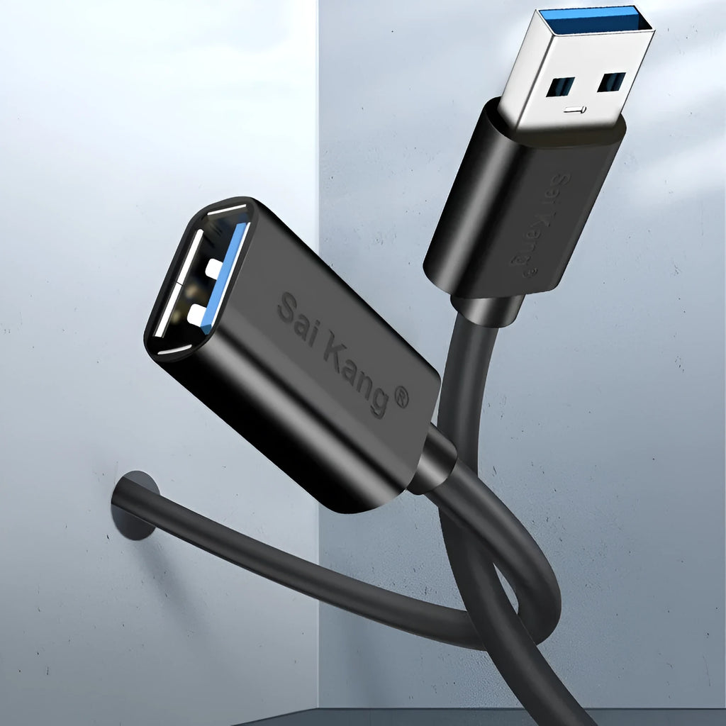 Black USB male to female extension cable on a desk, showing connector ends.