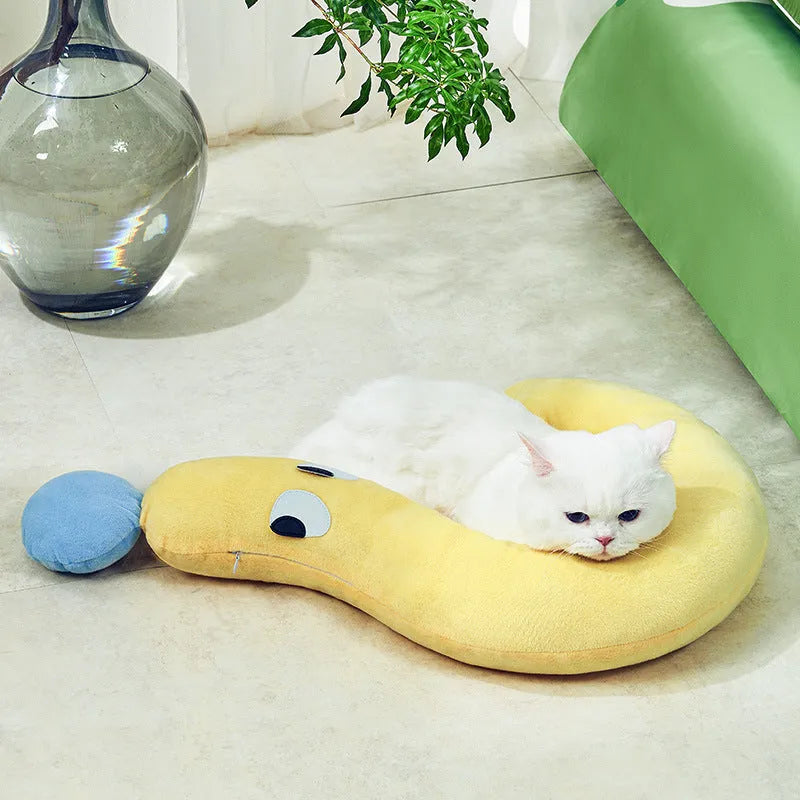 Blue rectangular pet pillow for cats and dogs on a floor, dimensions 62cm by 39cm.
