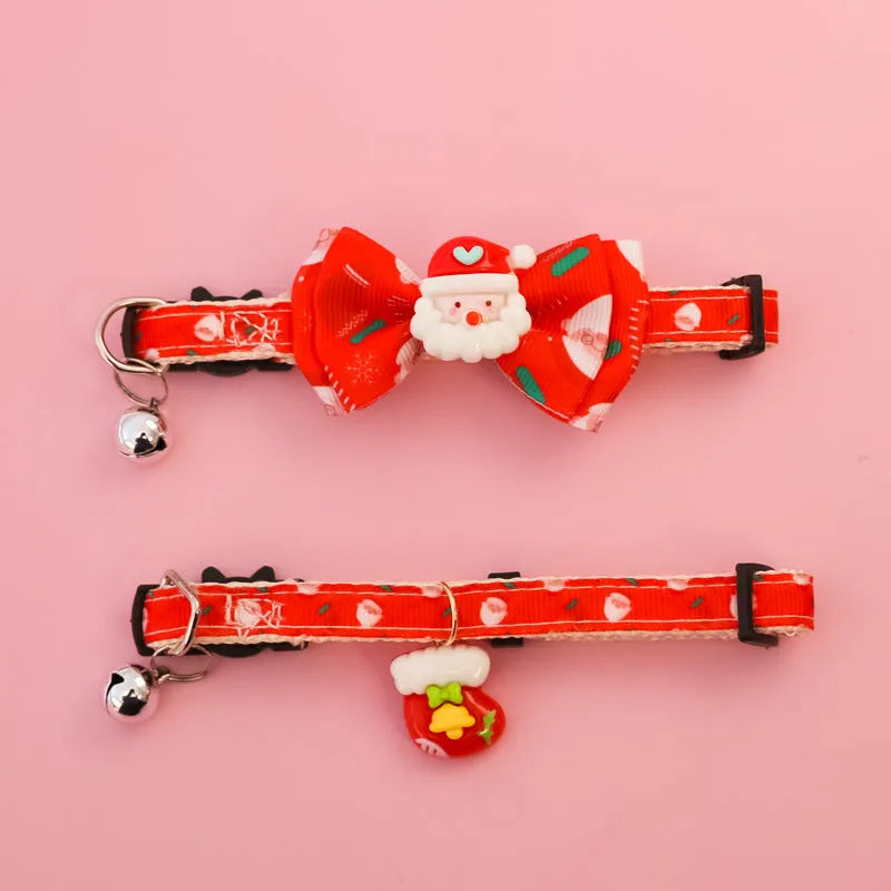 Christmas pet collar with bow tie, bell, and adjustable strap featuring Santa Claus and tree patterns