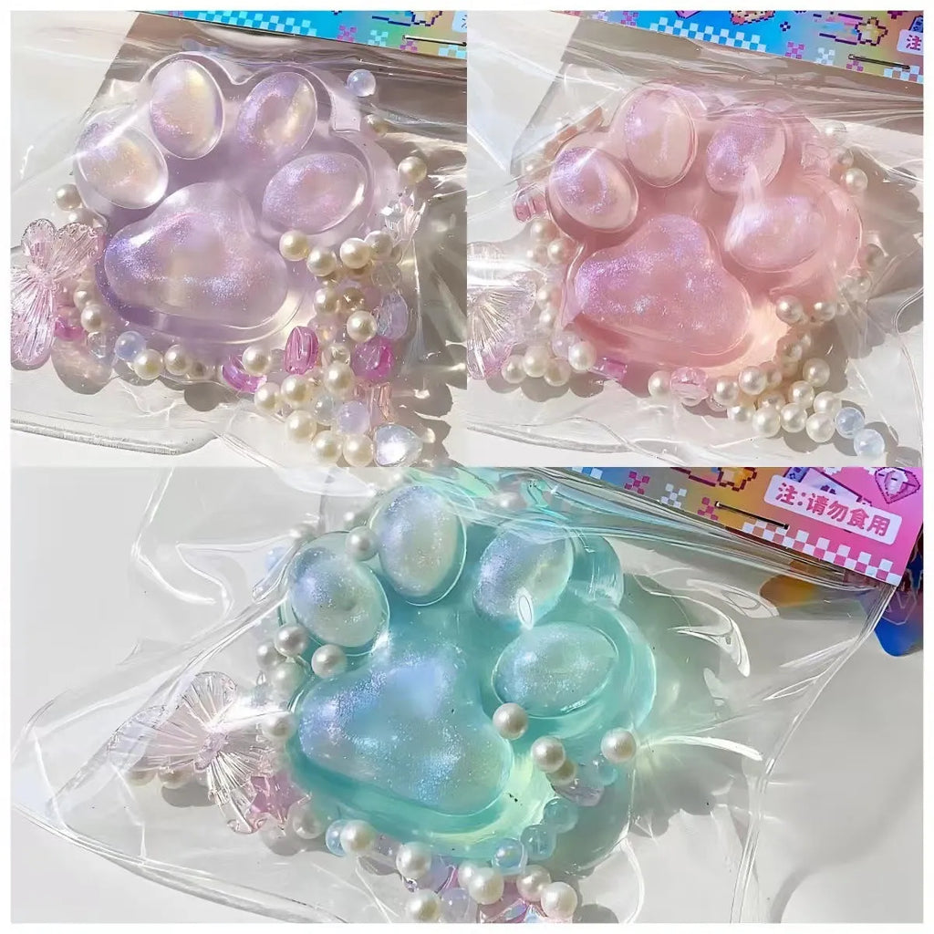 Transparent crystal coloured cat's paw squeezing toy made of soft TPR material
