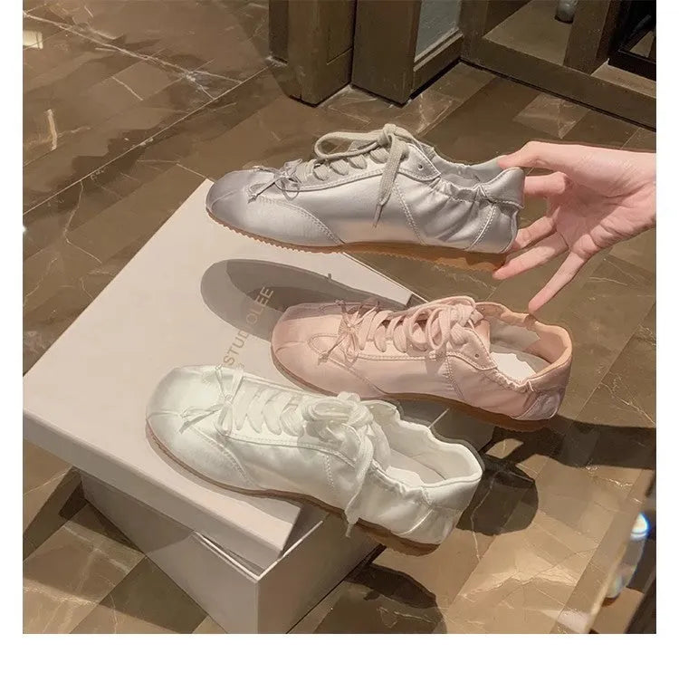 Women's silver grey satin ballet style sports board shoes with round toe and front lace-up design