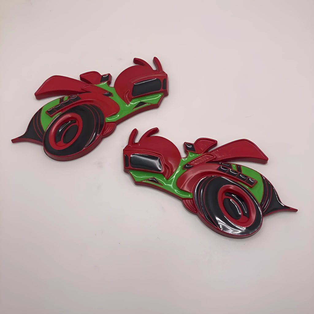 Pair of large zinc alloy Big Bee car bumper stickers showing front design and colour options.