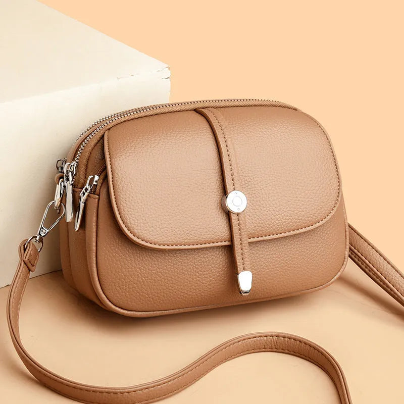 City Simple women's oval crossbody shoulder bag in soft PU leather with sewing thread details