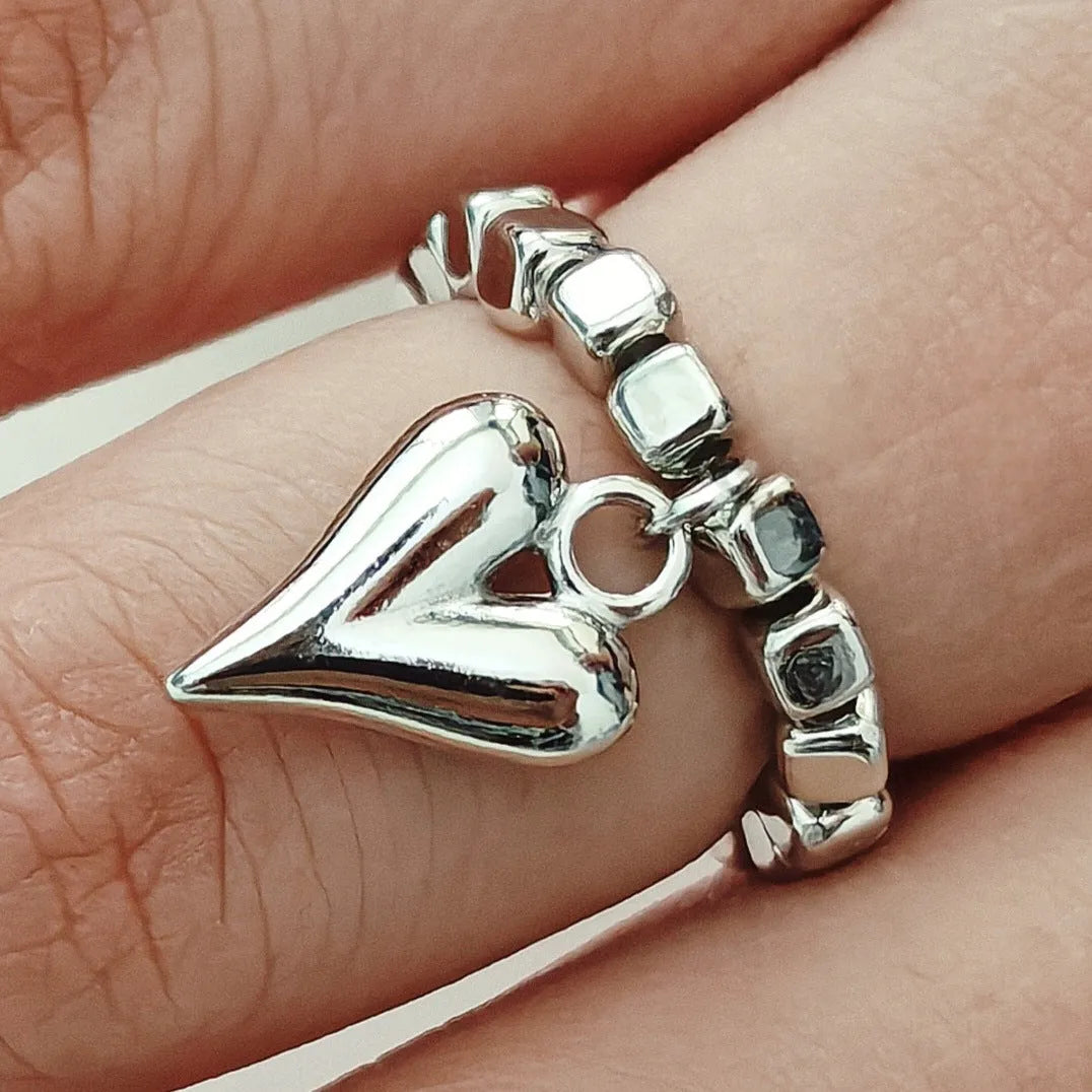 Handmade beaded elastic string love ring with geometric heart design in electroplated colours