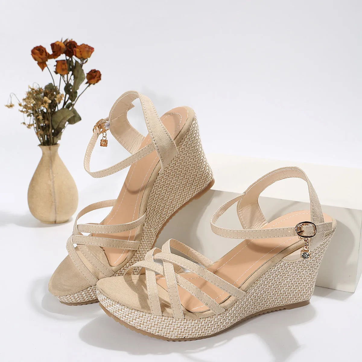 Women's black wedge sandals with fish mouth open toe and cloth upper on a white background.