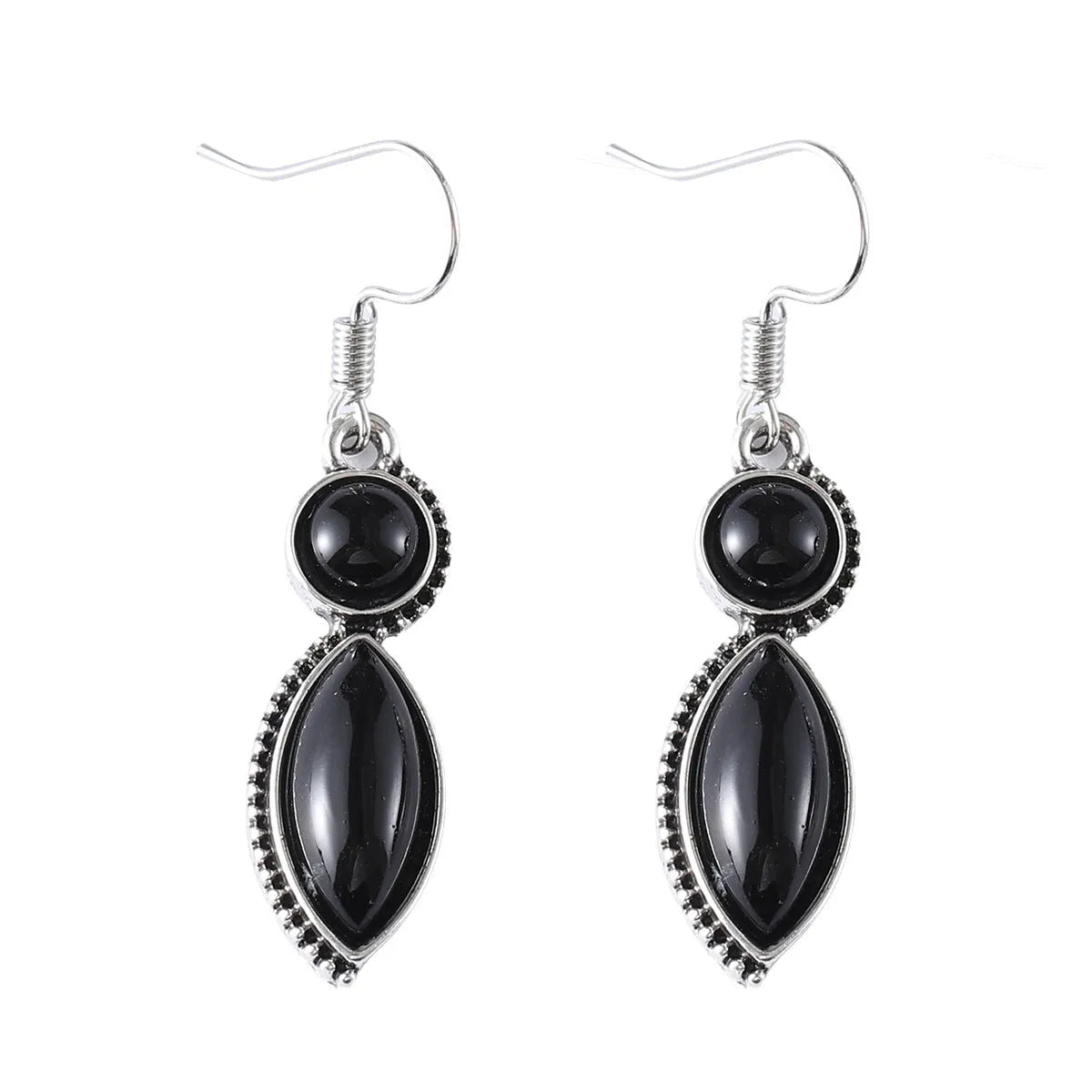 Vintage silver-tone geometric drop earrings with round purple and black stones on a grey background.