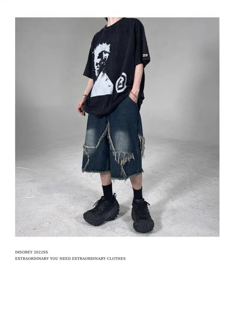 Blue denim shorts with frayed five-pointed star design and loose fit construction
