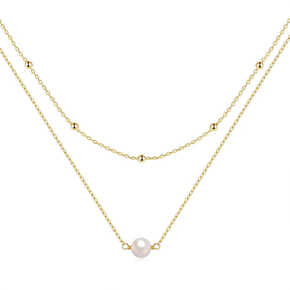 Sterling silver geometric pendant necklace with two pearls, on a ball bead chain, shown in gold and white gold plating.
