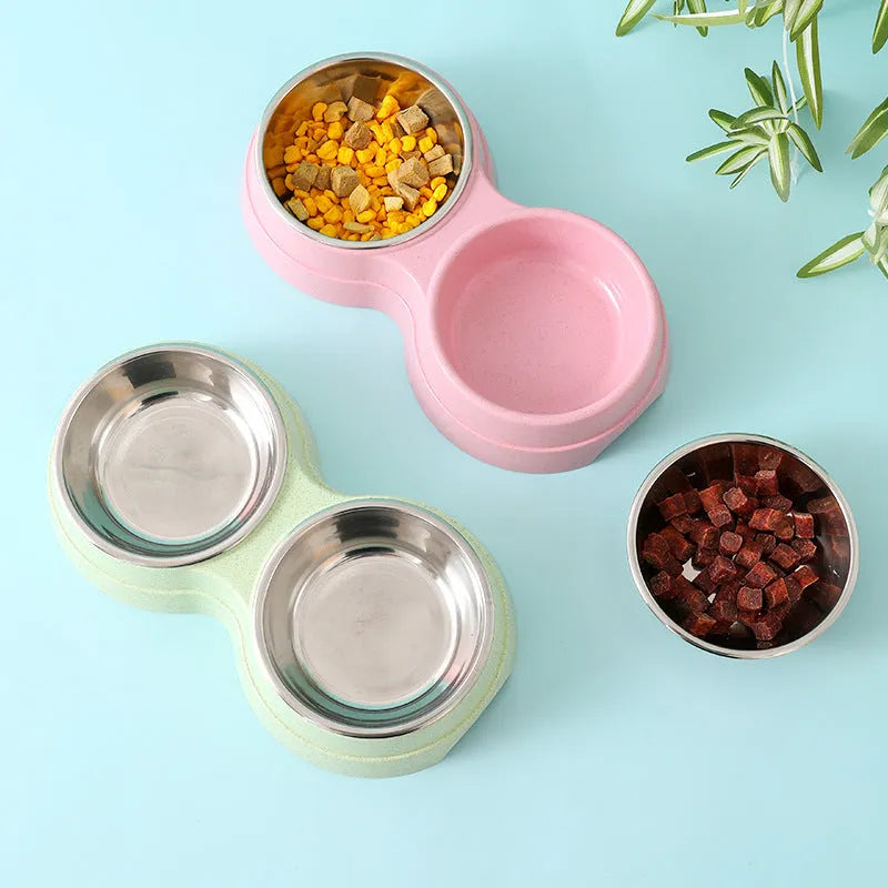 Double pet bowl set with two stainless steel bowls and blue straw holder on white background