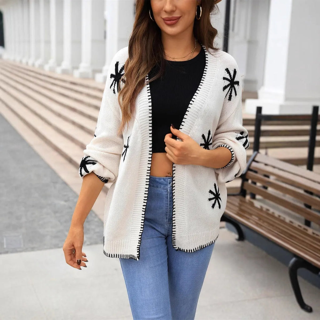 Beige plus size women's knitted coat with floral jacquard pattern and off-neck collar.