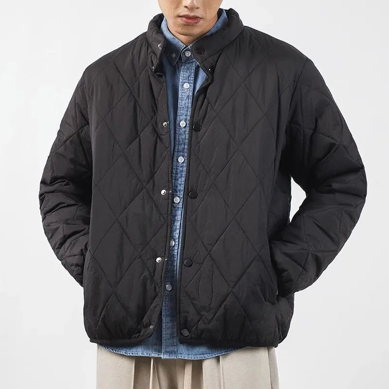 Men's black diamond lattice quilted winter jacket with extended length and loose fit.