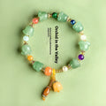Carved natural Xinjiang Jinsi jade bracelet with aventurine orchid beads and Gobi jade topaz accents.