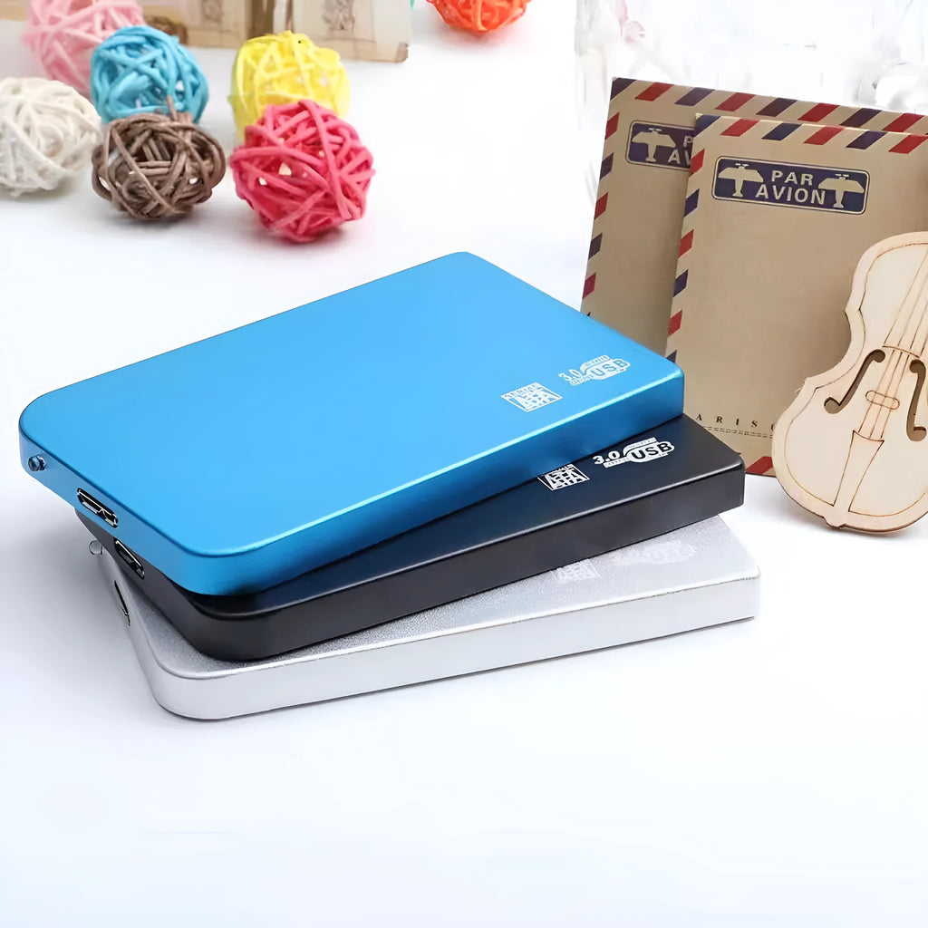 Silver USB 3.0 portable solid state drive with metal casing next to its included data cable.