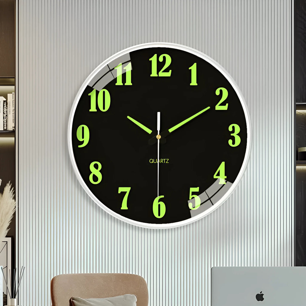 Modern 8 inch luminous wall clock in plastic case on a wall.