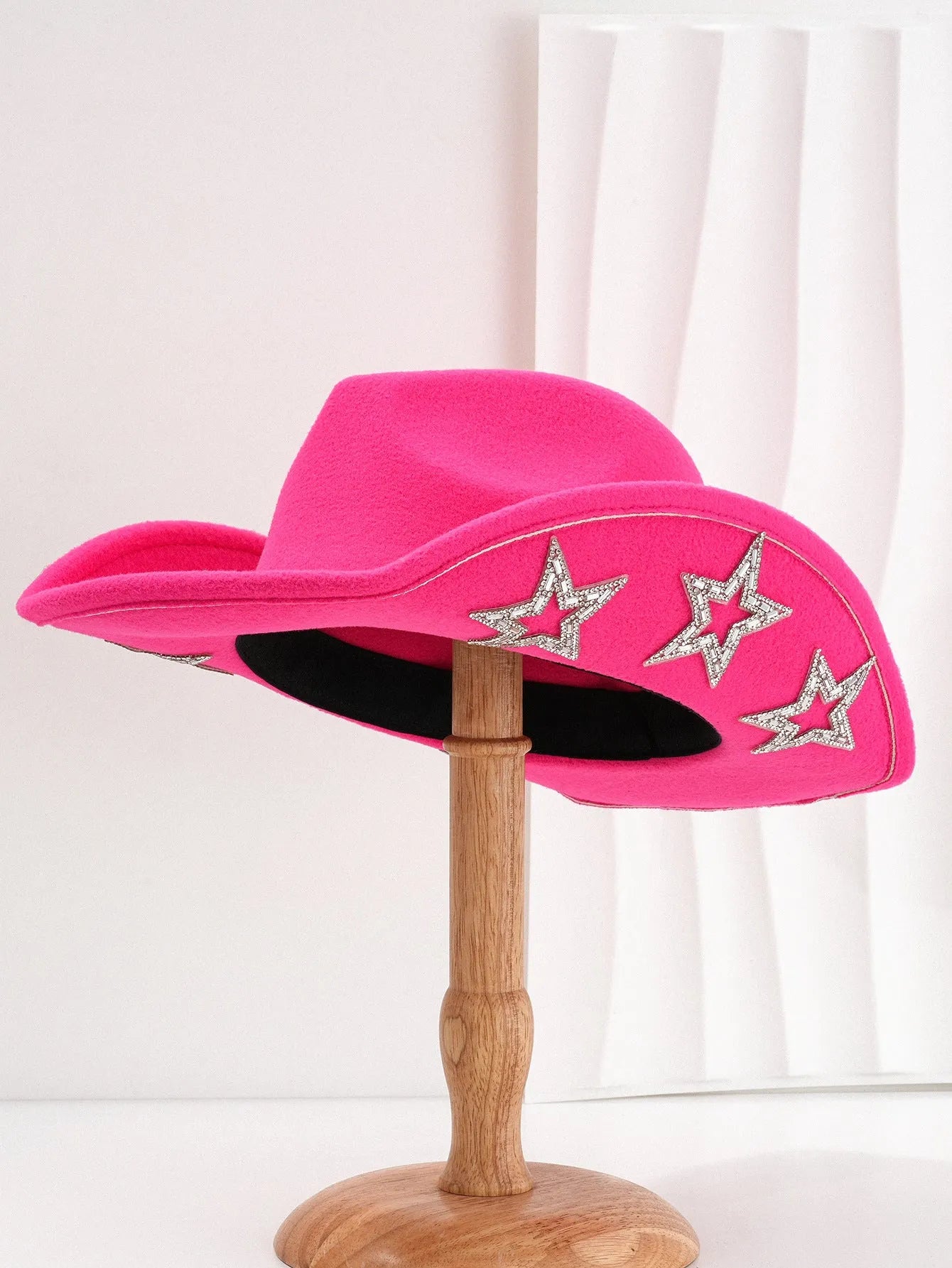 Beige wool felt western cowboy hat with a hexagonal star on the side, conical crown.