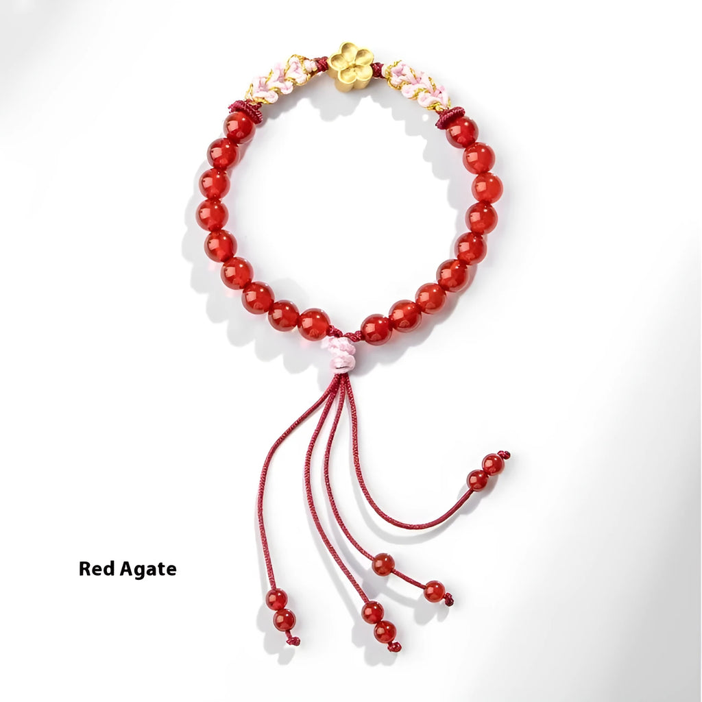 Chinese style women's bracelet with hand-woven red rope and peach blossom crystal charms