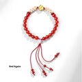 Chinese style women's bracelet with hand-woven red rope and peach blossom crystal charms