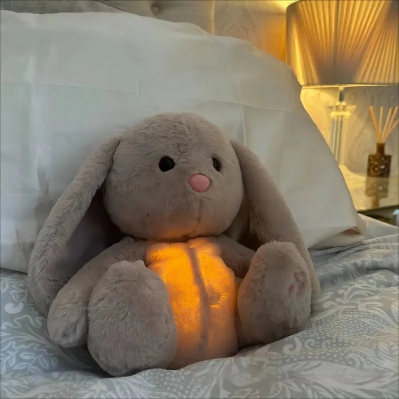 Breathing rabbit plush toy with moving belly, music functions, and soft fabrics for infant comfort