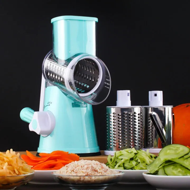 Blue round manual mandoline slicer with stainless steel blade for vegetables on a kitchen counter.