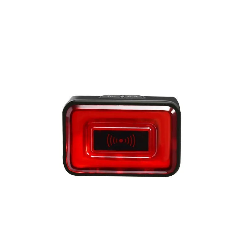 Compact black radar bicycle taillight with dual mount bracket on a bike seat post