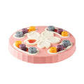 Blue interactive dog slow feeder toy with rotating central pillar on a non-slip base
