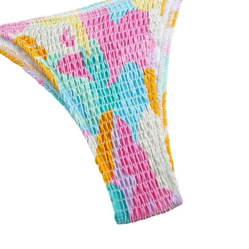 Women's triangle bikini swimming suit with floral gradient pattern and smocking craft detailing
