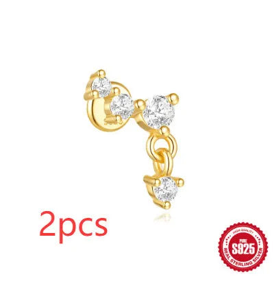S925 sterling silver geometric moon and star earrings with diamond accents on a gold-coloured background.