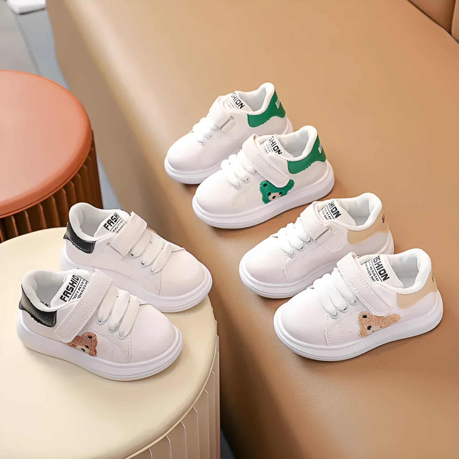 Baby Bear cartoon pattern kids sports sneakers in black, green, and khaki on a white background.