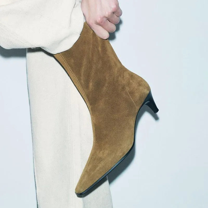 Brown square toe ankle boots with a side zip and a waterproof platform kitten heel.