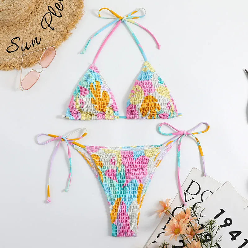 Women's triangle bikini swimming suit with floral gradient pattern and smocking craft detailing