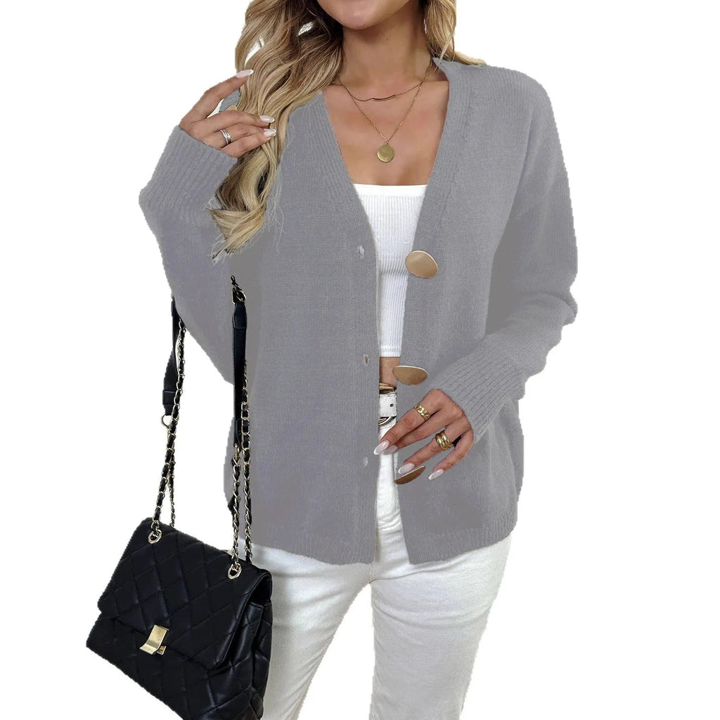 A grey women's deer plush sweater coat with long princess sleeves and an irregular hem.