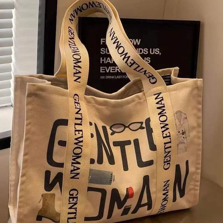 Large canvas women's tote bag with printed design options including letters and patterns