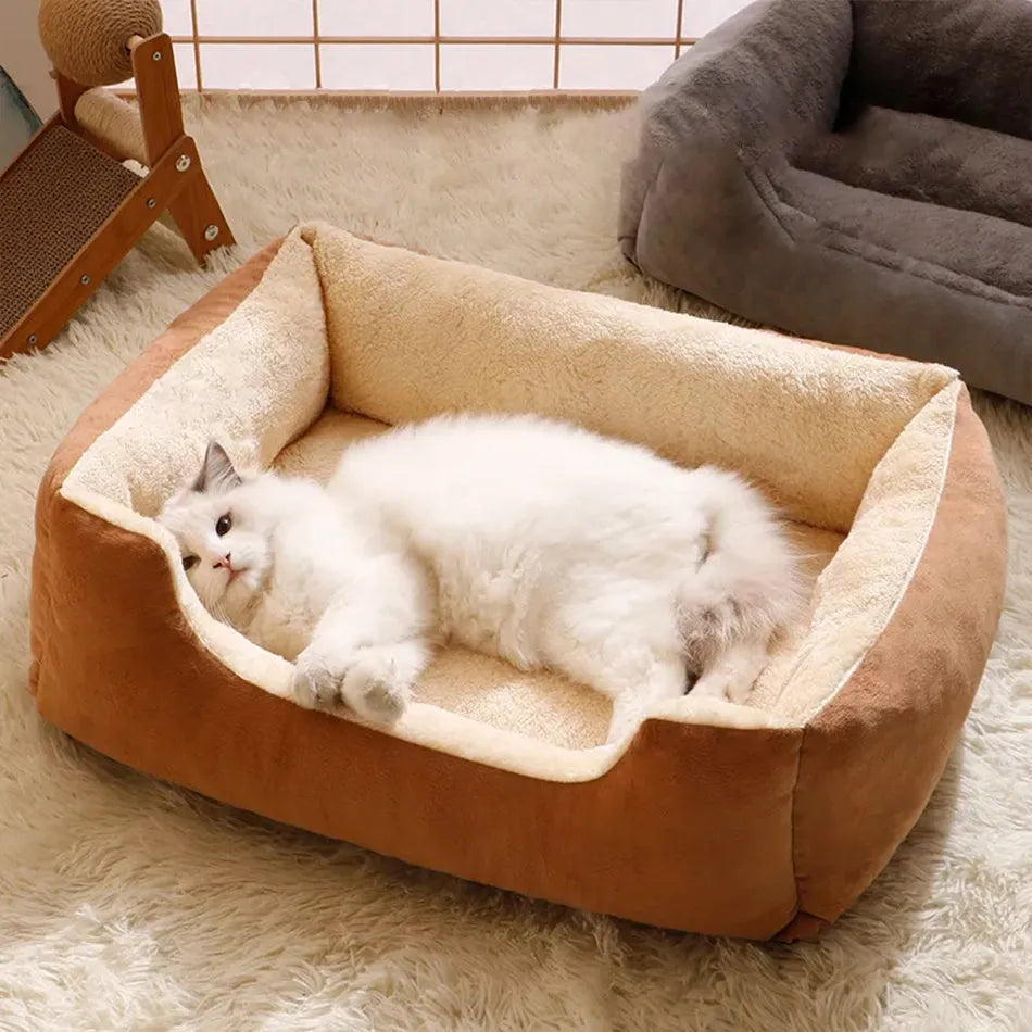 Soft short plush pet bed for cats and dogs in grey, shown in a large size on a wooden floor.