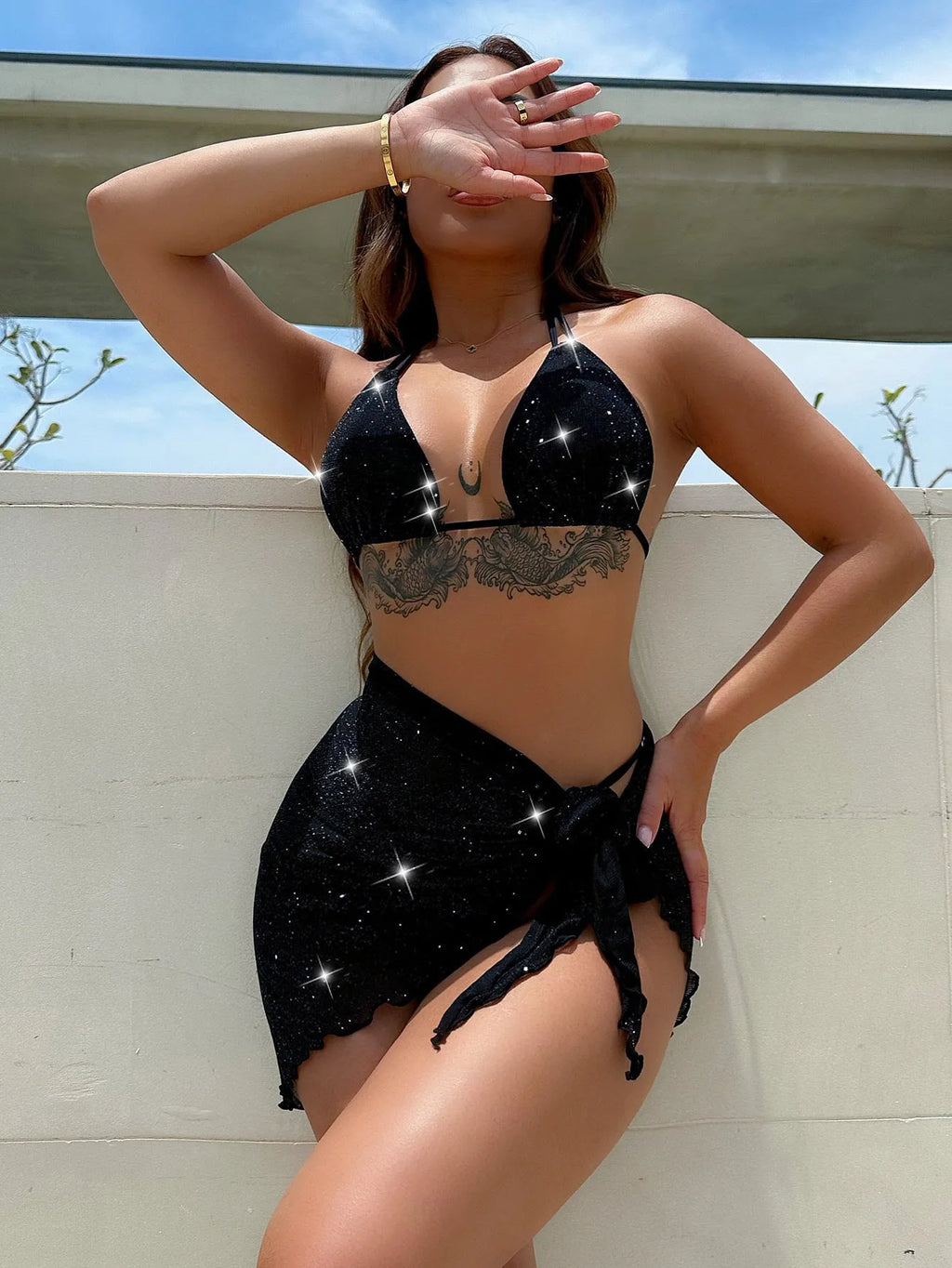 Black women's three-piece bikini set with separate top and shorts on a mannequin.
