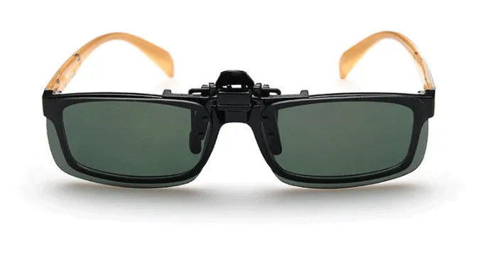 Clip-on sunglasses with polarised PC lenses attached to prescription glasses for driving