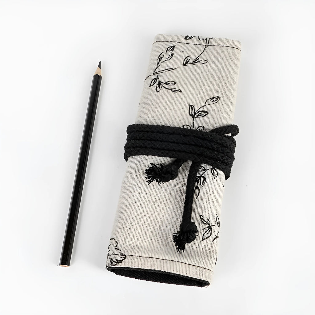 Black peony print canvas pencil roll bag showing cotton hemp construction with pencil storage holes
