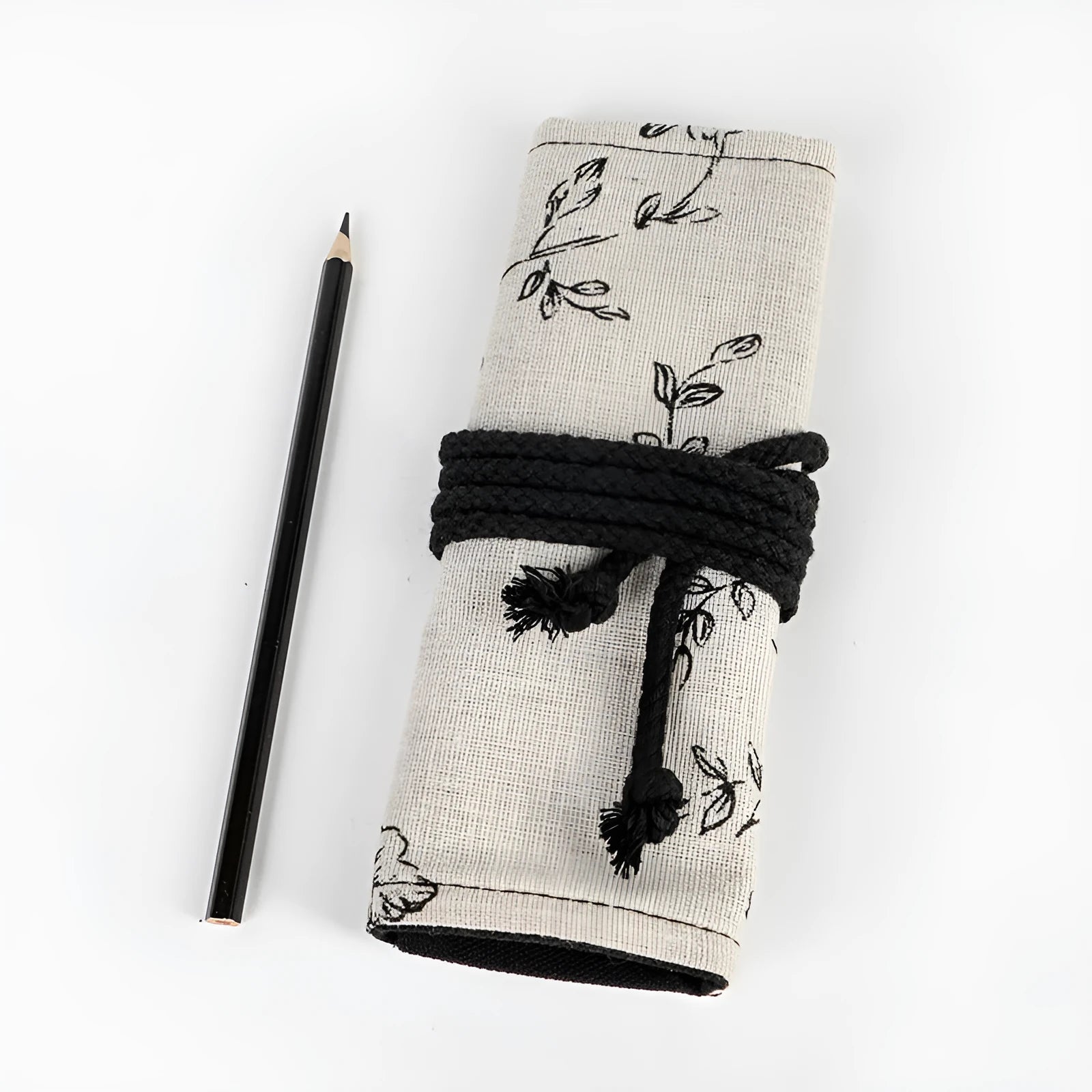 Black peony print canvas pencil roll bag showing cotton hemp construction with pencil storage holes