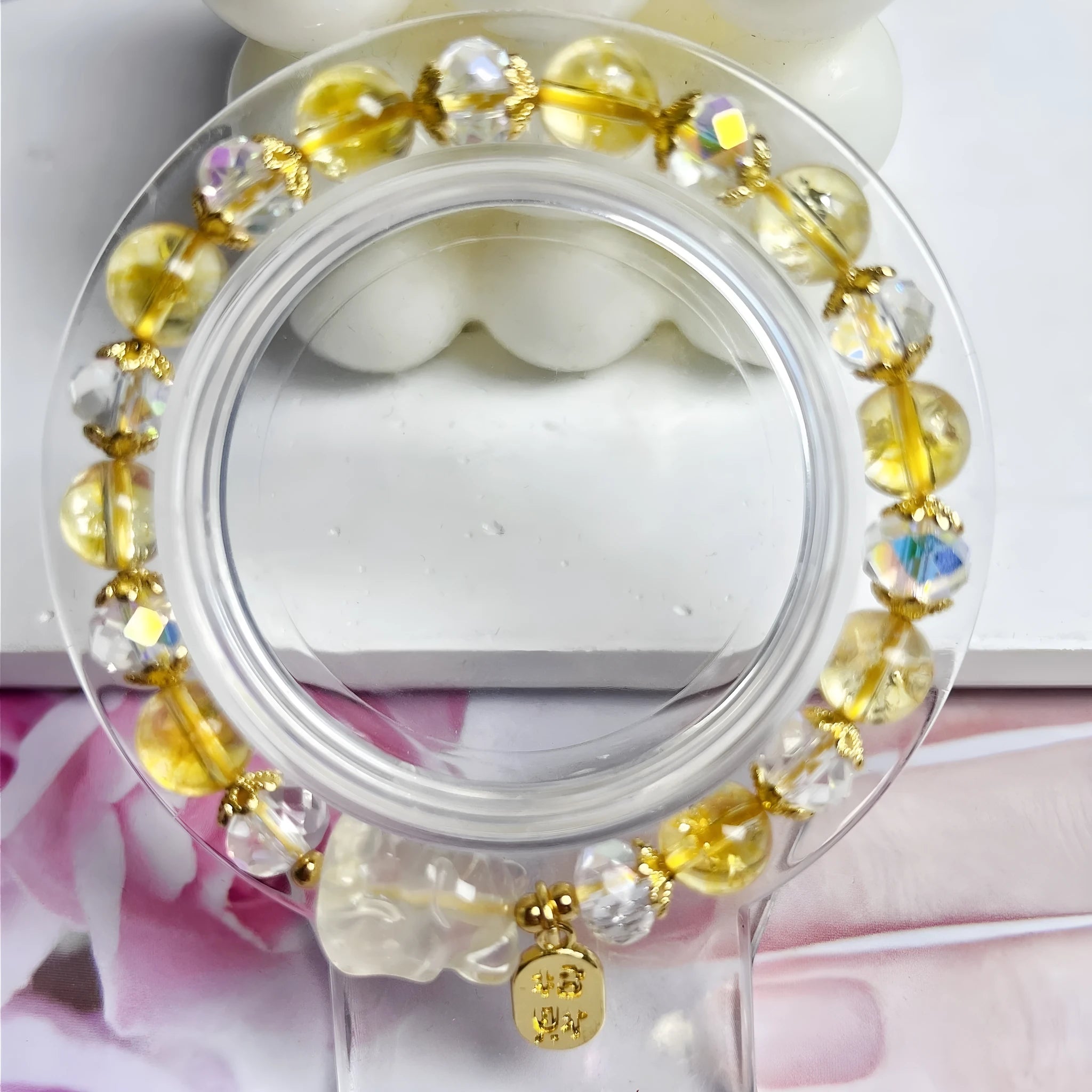 Handmade natural citrine crystal bracelet with detailed nine-tail fox design on a white background.