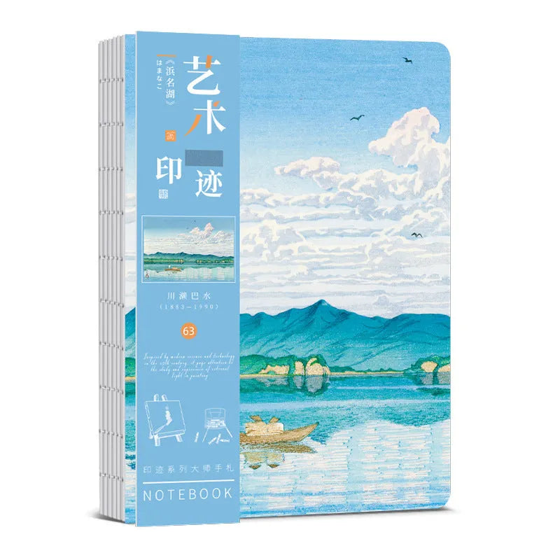 Hardcover Ukiyo-e art notebook open on a desk, showing the Kanagawa wave design and A5 size.