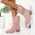 Women's mid-calf suede boots in lotus root colour with a 4cm stout heel and leather stitching detail on a wooden floor.
