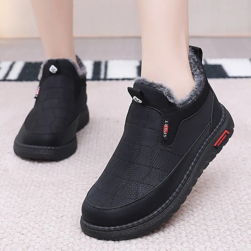 Women's black flat casual ankle boots with round toe and synthetic leather upper